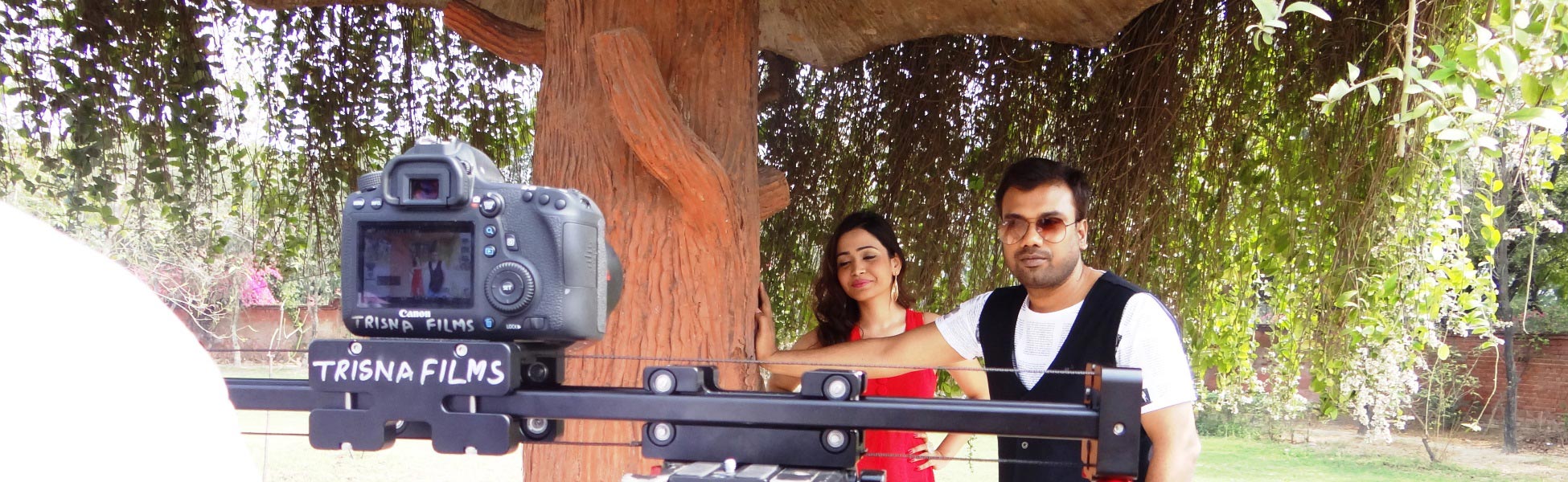 Trisna Films branded DSLR camera and slider setup on location during a music video shoot with actors in Delhi, India. film production house in Bengaluru South, video production house in Bengaluru South, tv production house in Bengaluru South, production house in Bengaluru South, film production company in Bengaluru South, video production company in Bengaluru South, tv production company in Bengaluru South, production company in Bengaluru South