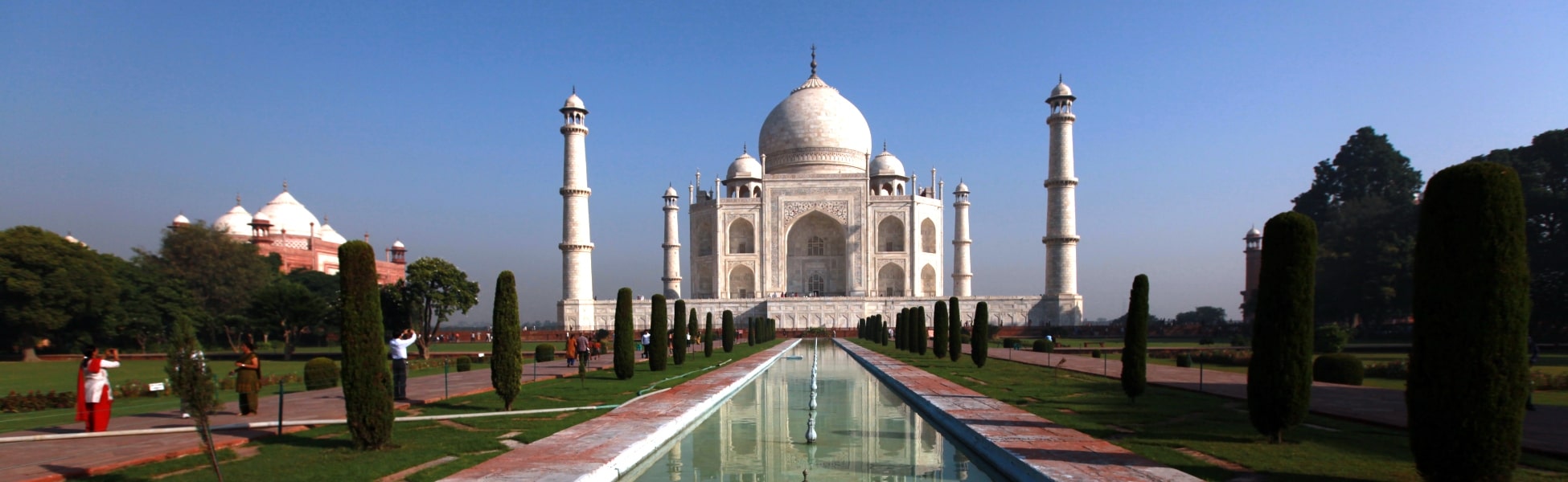 Panoramic daylight view of the iconic ivory-white marble Taj Mahal mausoleum, surrounding gardens, reflection pool, and four minarets in Agra, India, demonstrating prime angles for heritage film productions. fixer in Bengaluru South, film fixer in Bengaluru South, media fixer in Bengaluru South, movie fixer in Bengaluru South, production fixer in Bengaluru South,  line producer in Bengaluru South