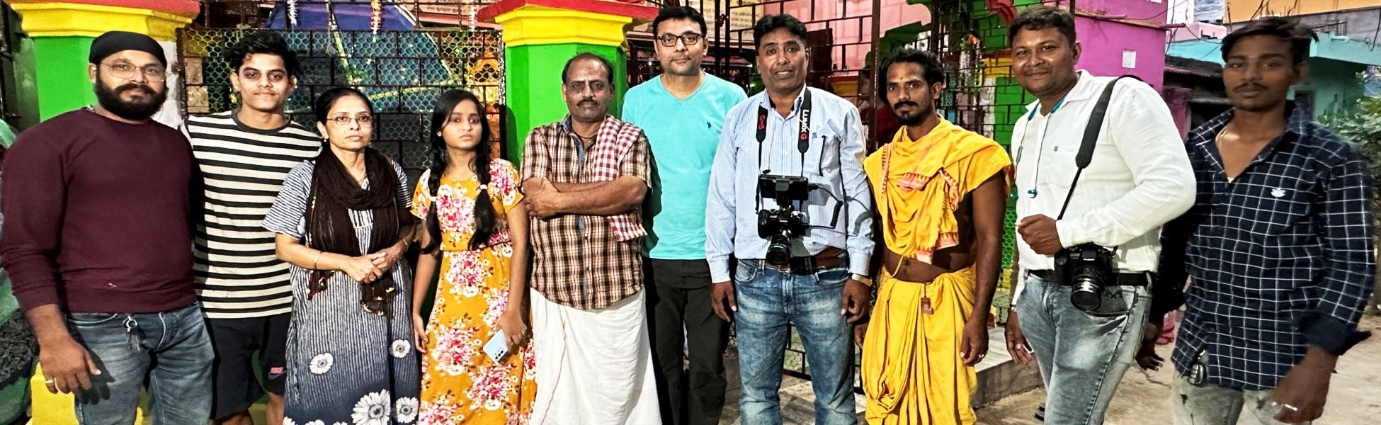 Cast, crew, and a client from Trisna Films® posing together with camera equipment outside a vibrant building during the short film production of 'Revenge: The Prelude' in Puri, Odisha, India. film shooting locations in india, film shooting locations in Delhi, film shooting locations in mumbai, film shooting locations in pune, film shooting locations in sonipat, film shooting locations in begusarai, video shooting locations in india, video shooting locations in Delhi, video shooting locations in mumbai, video shooting locations in pune, video shooting locations in sonipat, video shooting locations in begusarai, tv shooting locations in india, tv shooting locations in delhi, tv shooting locations in mumbai, tv shooting locations in pune, tv shooting locations in sonipat, tv shooting locations in begusarai, shooting locations in india, shooting locations in delhi, shooting locations in mumbai, shooting locations in pune, shooting locations in sonipat, shooting locations in begusarai