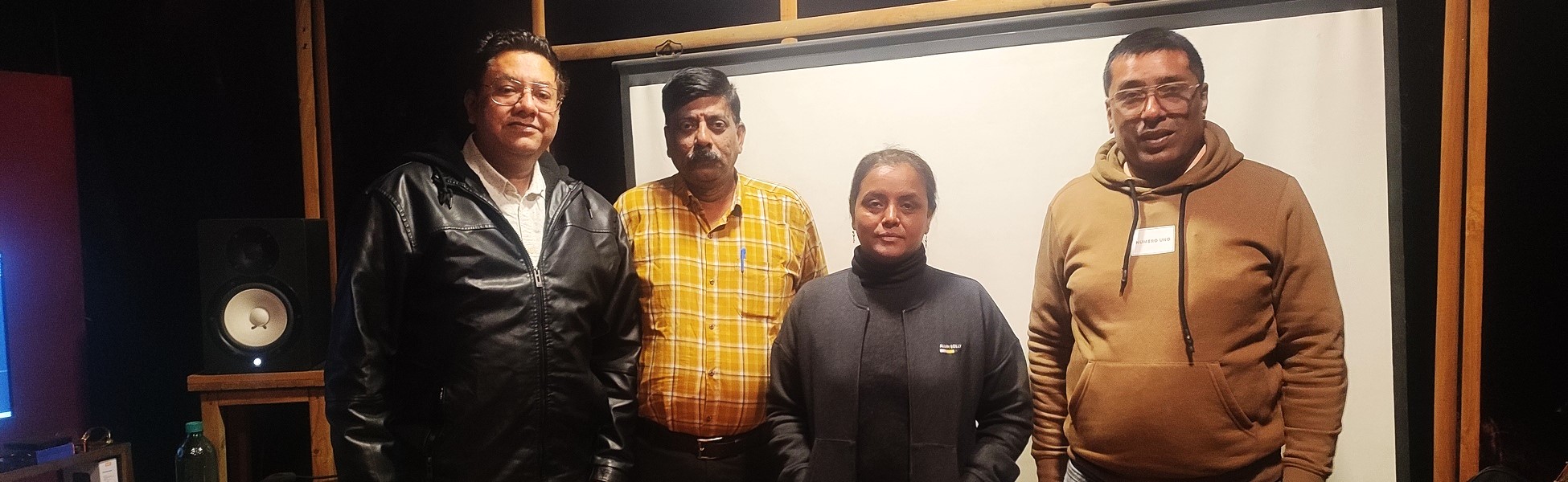 Four members of the Trisna Films® audio crew posing inside a recording studio in Delhi during an audio session for the Neev Energy corporate film. Fixer in Andhra pradesh, film fixer in andhra pradesh, media fixer in andhra pradesh, movie fixer in andhra pradesh, production fixer in andhra pradesh, line producer in andhra pradesh
