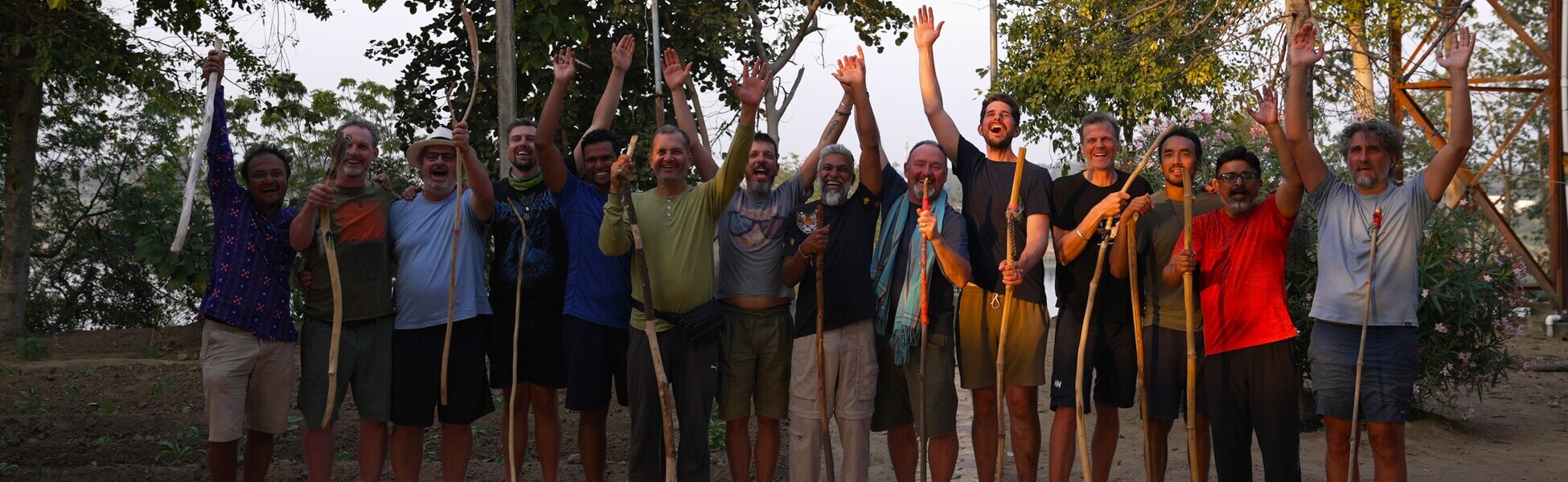 Twelve participants and two spiritual guides of the documentary film 'The New Man' celebrate with walking sticks on the banks of the Narmada River in India after completing their journey. film production house in Andorra, film production house in Andorra la vella, video production house in Andorra, video production house in Andorra la vella, tv production house in Andorra, tv production house in Andorra la vella, production house in Andorra, production house in Andorra la vella, film production company in Andorra, film production company in Andorra la vella, video production company in Andorra, video production company in Andorra la vella, tv production company in Andorra, tv production company in Andorra la vella, production company in Andorra, production company in Andorra la vella