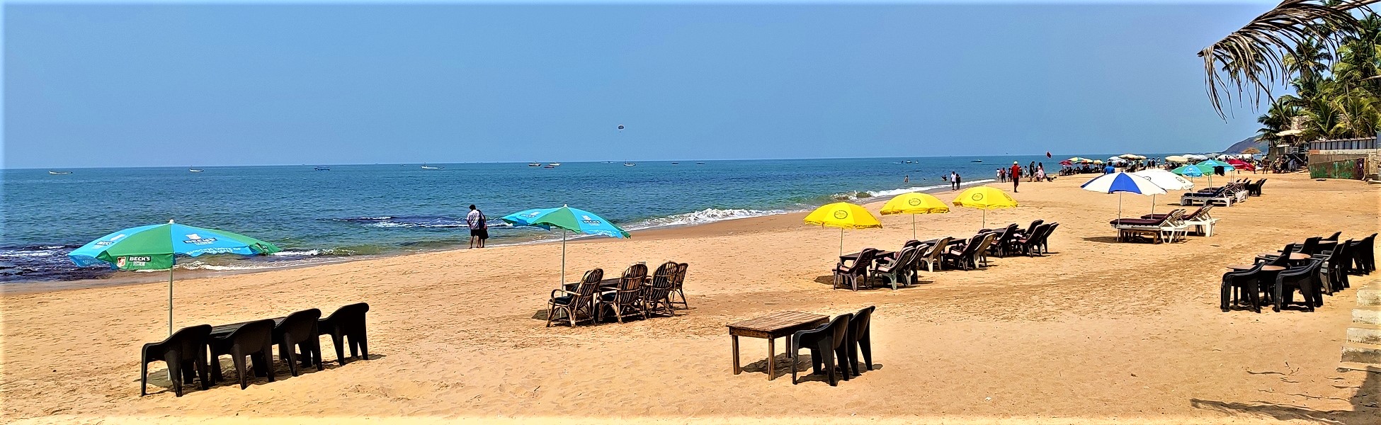 Goa, Anjuna Beach ad film production managed by Trisna Films®. The photo shows a professional set arrangement with beach umbrellas and seating, demonstrating expert line production and location management in India. fixer in Arwal, film fixer in arwal, media fixer in arwal, movie fixer in arwal, production fixer in arwal, line producer in Arwal