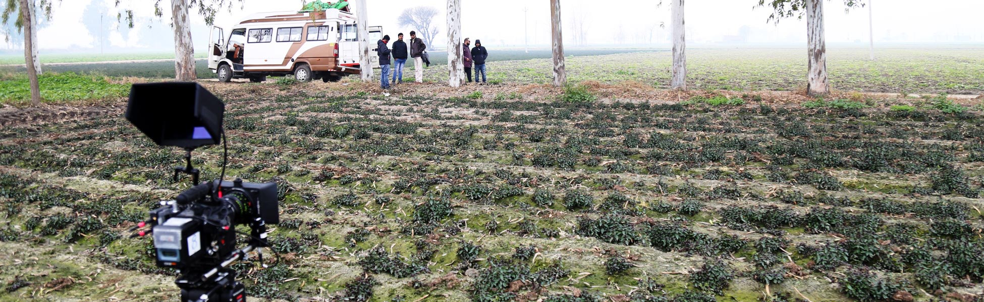Trisna Films® crew and professional camera rig on set in a rural field in Ludhiana, Punjab, for a web series production.Caption (UX)Behind the scenes with the Trisna Films crew during a web series shoot in the fields of Ludhiana, Punjab. filmmaking workshop in india, cinematography workshop in india, camera workshop in india, editing workshop in india, vfx workshop in india, animation workshop in india, photography workshop in india, direction workshop in india, script writing workshop in india