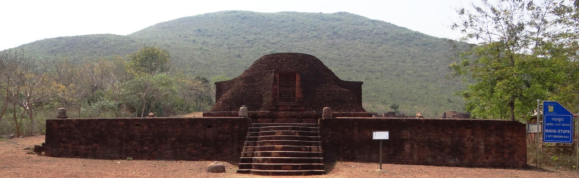 A wide cinematic shot of the ancient brick Maha-Stupa at Udayagiri Buddhist Monastery ruins in Odisha, India, showcasing its semicircular dome and stone steps—a premier historical filming location curated by Trisna Films®. fixer in Ayodhya, film fixer in ayodhya, media fixer in ayodhya, movie fixer in ayodhya, production fixer in ayodhya, line producer in Ayodhya