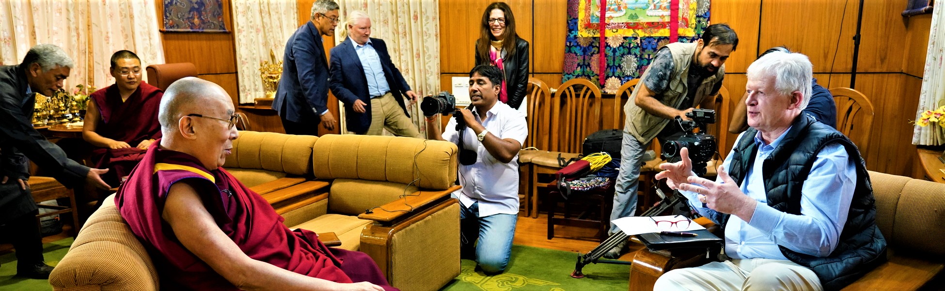 A professional camera crew and line production team filming an international documentary interview with His Holiness the 14th Dalai Lama and a Western journalist inside his residence in Dharamshala, Himachal Pradesh, India. film production house in Bahrain, film production house in manama, video production house in Bahrain, video production house in manama, tv production house in Bahrain, tv production house in manama, production house in Bahrain, production house in manama, film production company in Bahrain, film production company in manama, video production company in Bahrain, video production company in manama, tv production company in Bahrain, tv production company in manama, production company in Bahrain, production company in manama